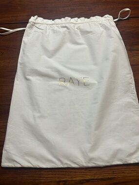 RAYE Cream Drawstring Dust Bag with Gold Logo